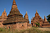 The cluster of red brick temples, named Khay-min-gha on the map on the North plain of Bagan. Myanmar. 